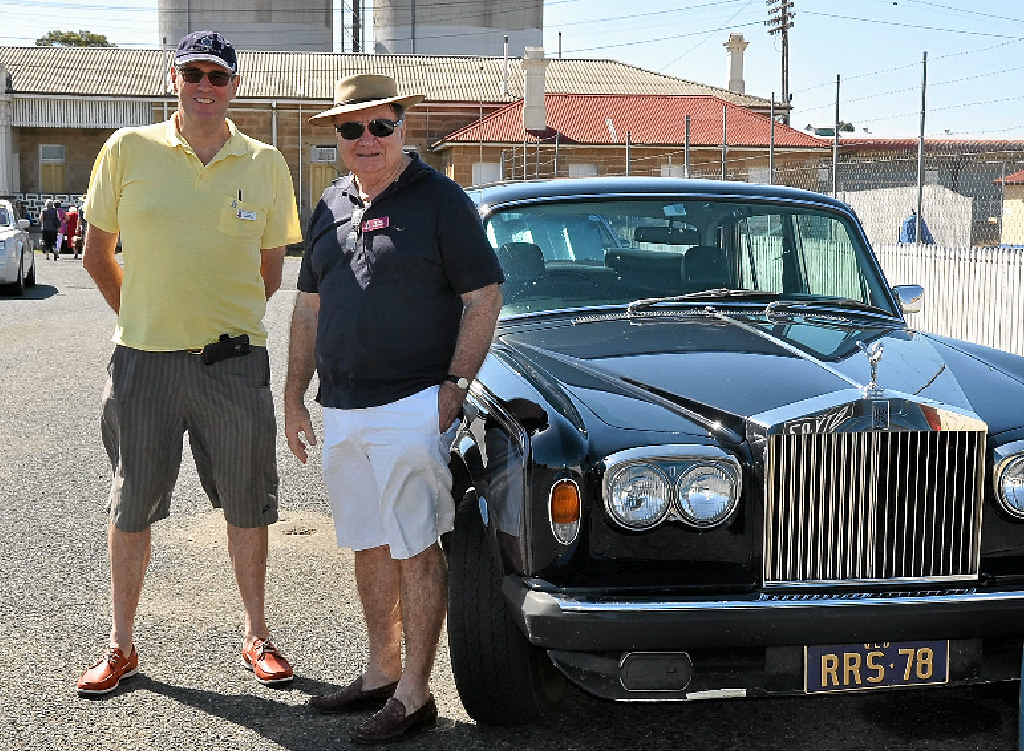 CLASSY RIDE: Rolls-Royce owners Charles MacDonald and Peter Schneider with a 1978 Silver Shadow 2 were in the Rose City yesterday for a steam train trip.